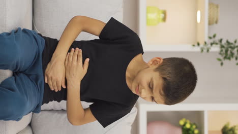 Vertical-video-of-Boy-who-is-not-feeling-well.